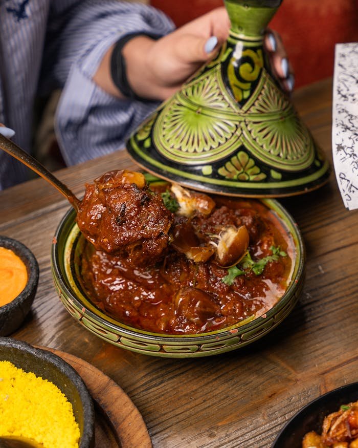 Authentic Moroccan lamb tagine served hot in a traditional dish. Perfect blend of flavors.